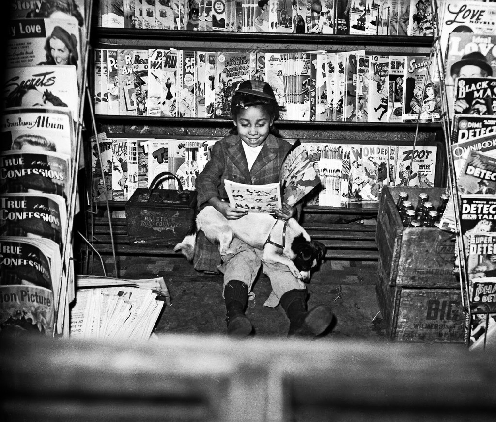 Girl reading Mickey Mouse and the Submarine Pirates comic book in newsstand photographed by Charles “Teenie” Harris, 1947